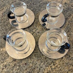Bodum Clear Glass Tea Cups with Black Handles and Silver Saucers (Set of 4)